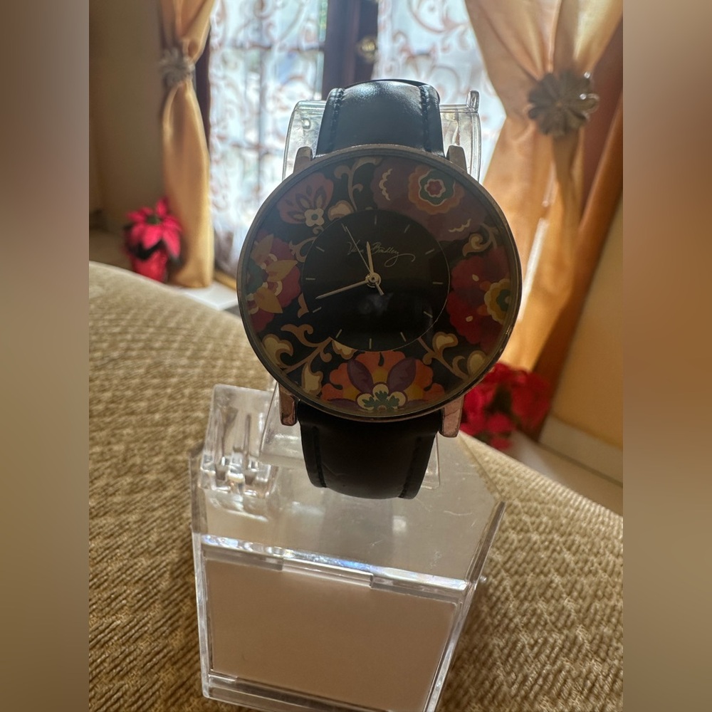 Vera Bradley Floral women's quartz watch with a black genuine leather strap.Runs